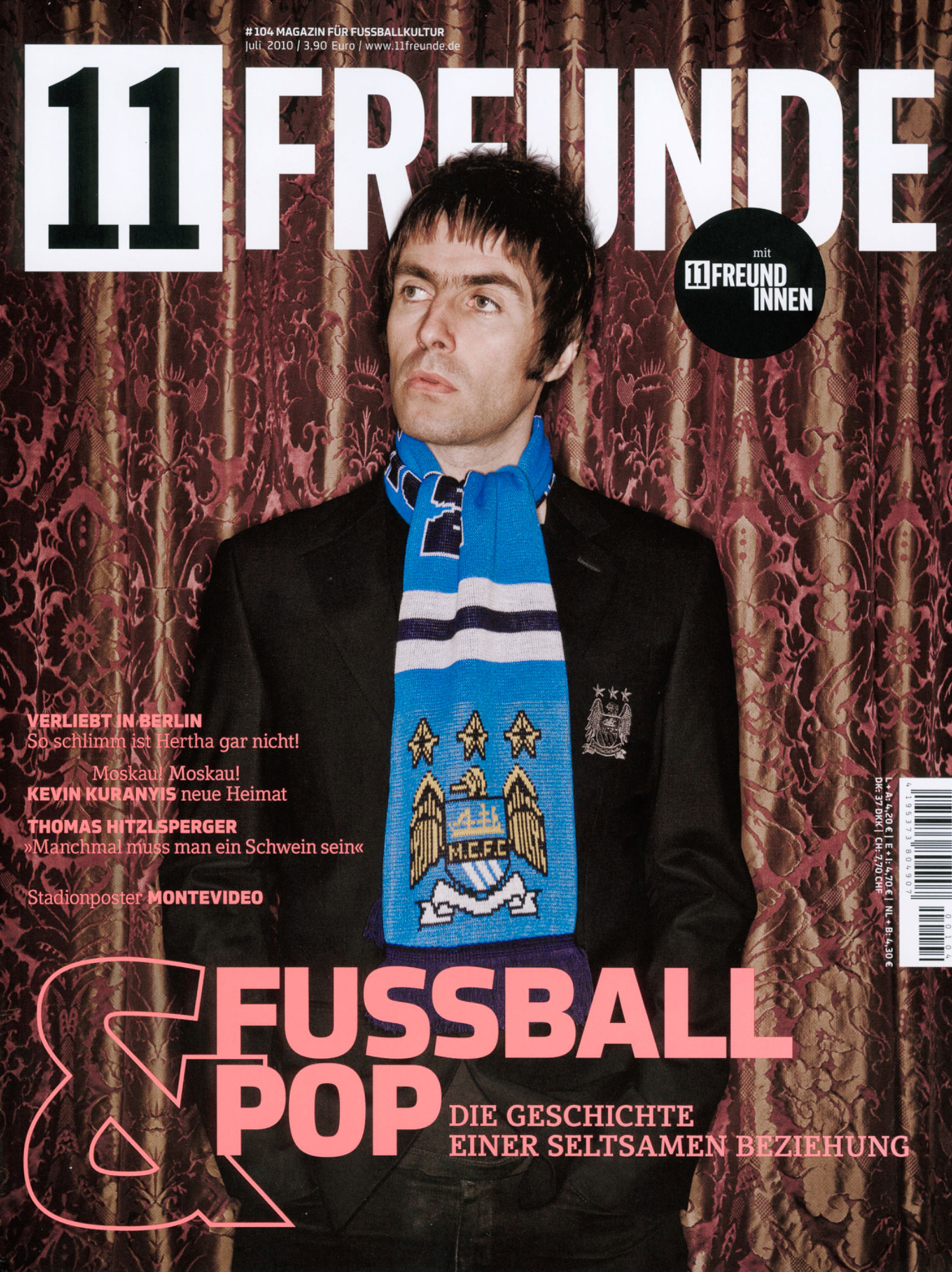 Liam Gallagher lead singer of Oasis in Manchester City Football scarf